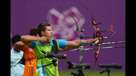 Slovenia's Klemen Strajhar gets ready to arch during the Archery Ranking Round at the Lord's Cricket Ground as part of the Olympics' opening day Friday.