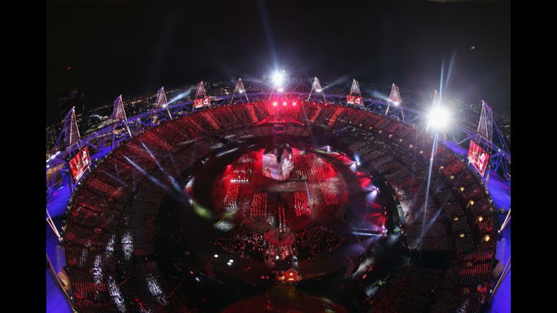 The Olympic stadium lit up in red and blue during the opening ceremony.