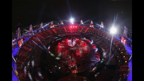 The Olympic stadium lit up in red and blue during the opening ceremony.  