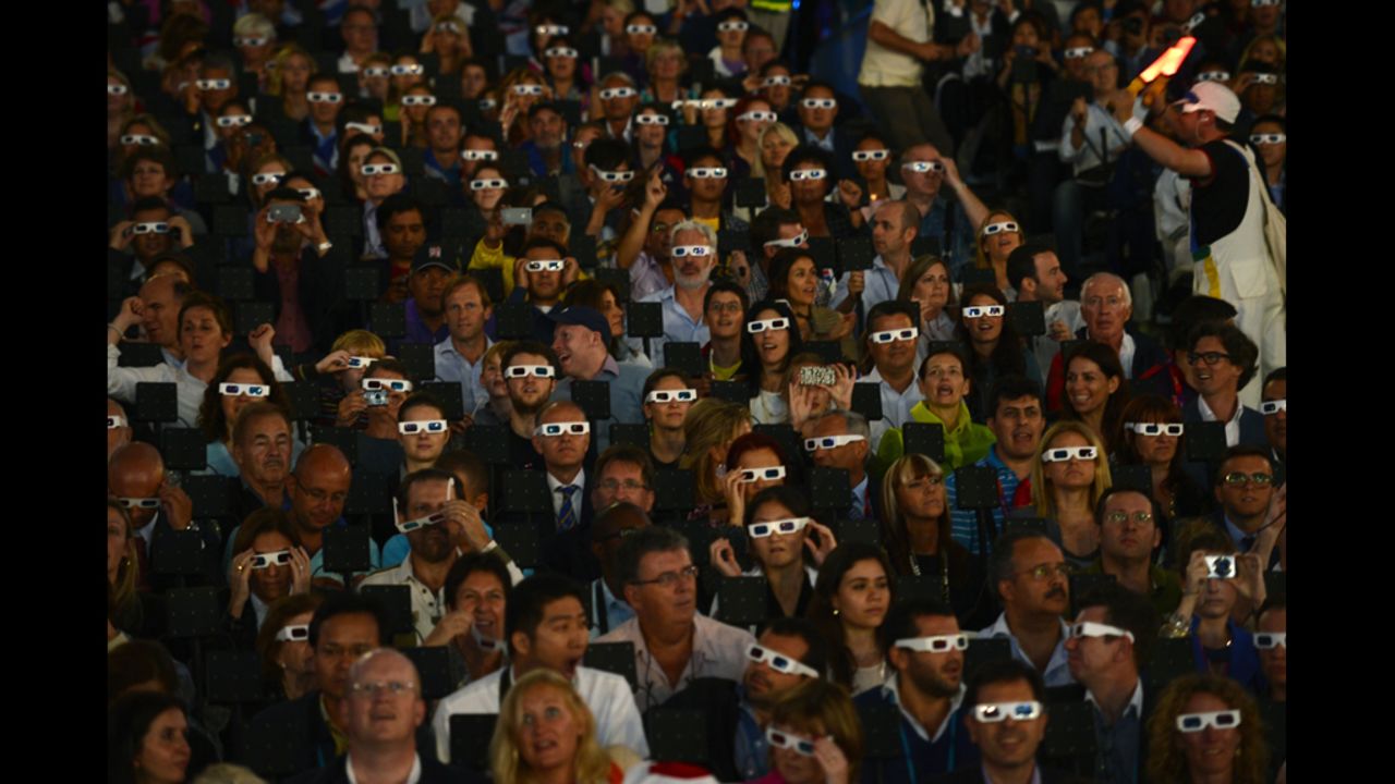 Spectators wearing 3-D glasses during the opening ceremony.