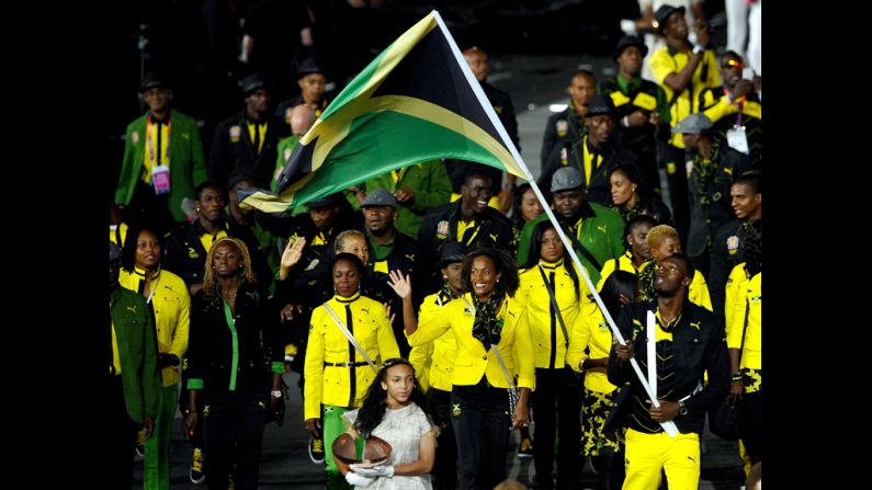 Usain Bolt leads the Jamaican Olympic team around the stadium.