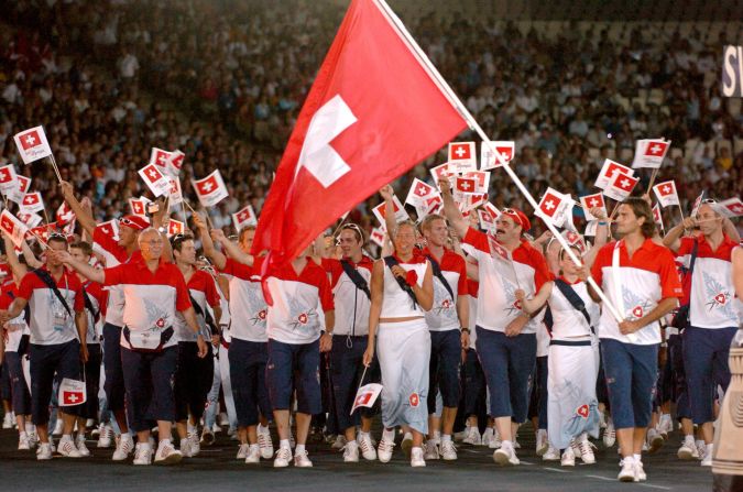 Federer carries his national flag at the opening ceremony of the 2004 Olympic Games in Athens. 