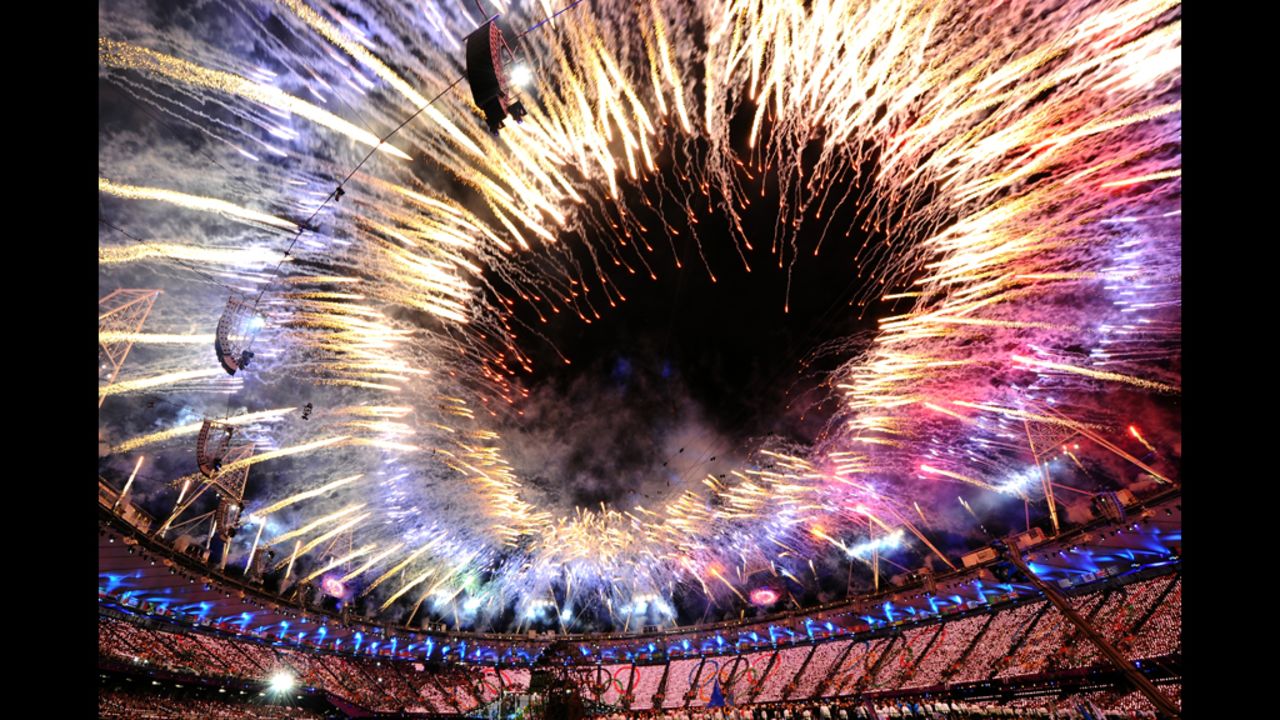 Fireworks form a fiery ring over the Olympic Stadium.