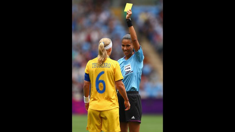 Sweden's Sara Thunebro is given a yellow card during a women's first-round soccer game. 