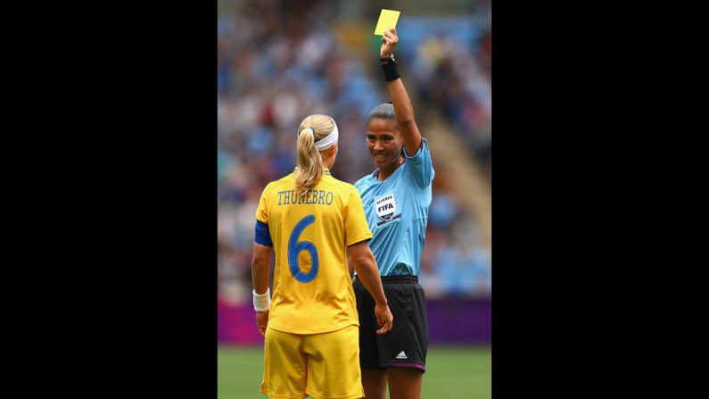 Sweden's Sara Thunebro is given a yellow card during a women's first-round soccer game.