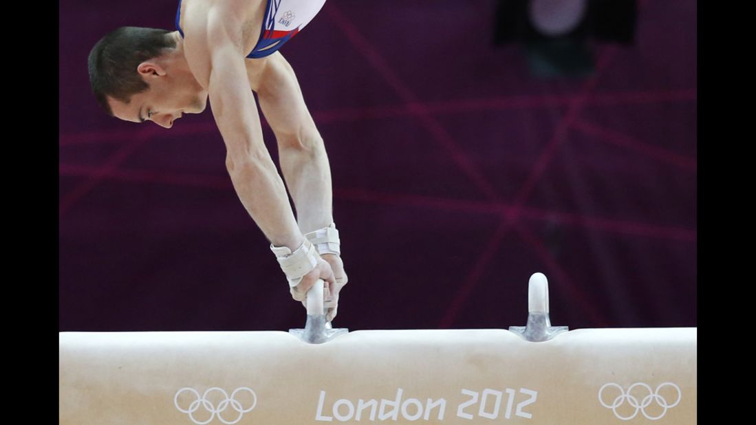 French gymnast Cyril Tommasone competes on the pommel horse during the men's qualification of the artistic gymnastics event.