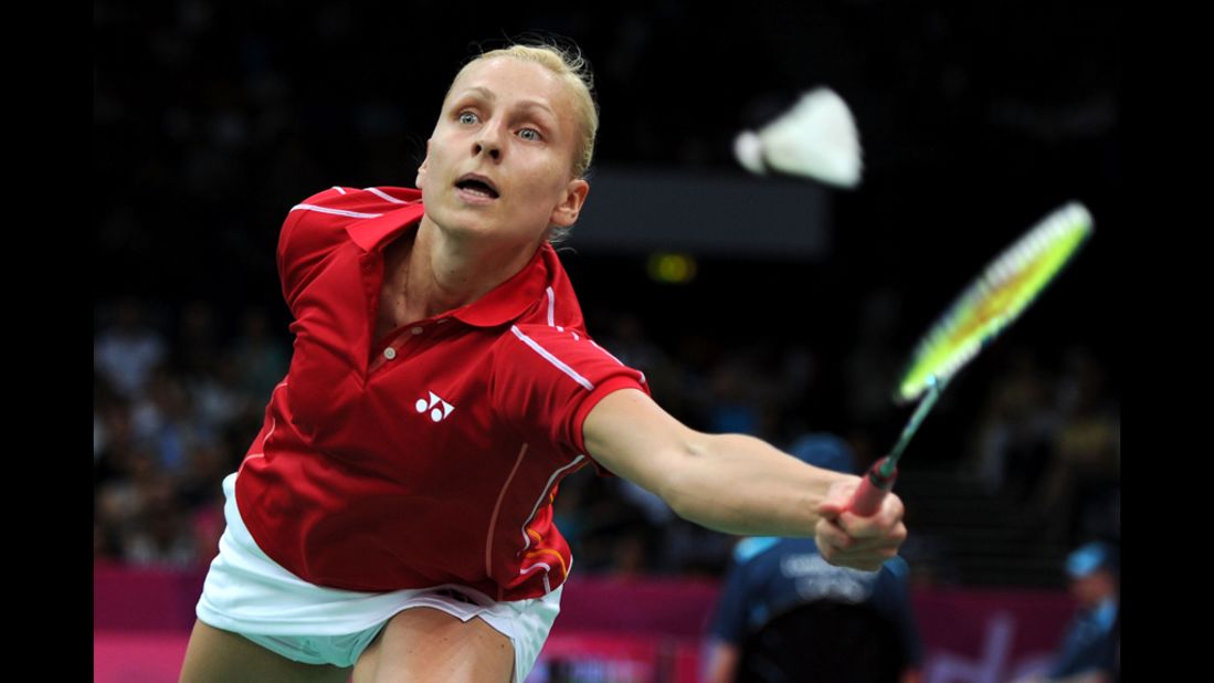 Kamila Augustyn of Poland looks for a shot against Anastasia Prokopenko of Russia during the women's singles badminton match.