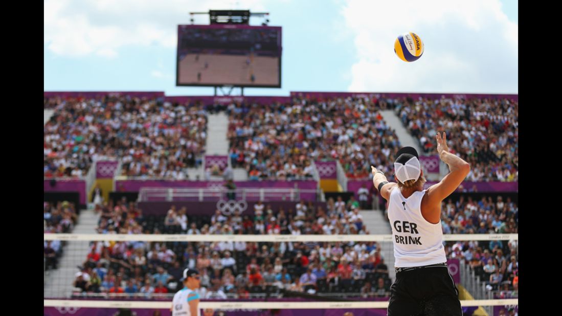 Julius Brink of Germany spikes the ball during the men's beach volleyball match against Russia.