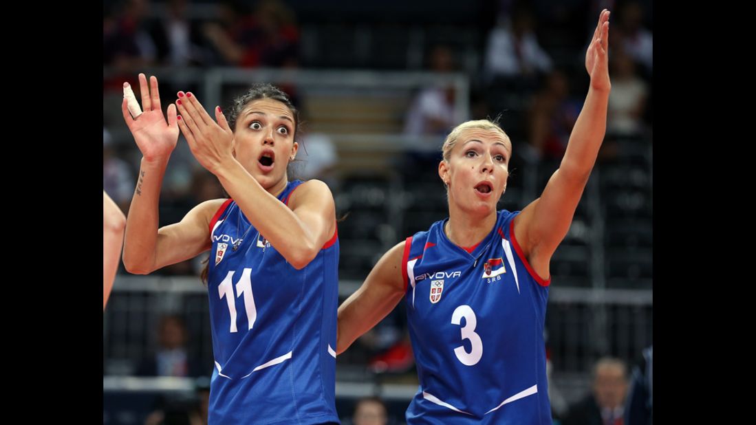 Stefana Veljkovic, No. 11, and Ivana Djerisilo, No. 3, of Serbia react to a lost point to China during the women's volleyball game.