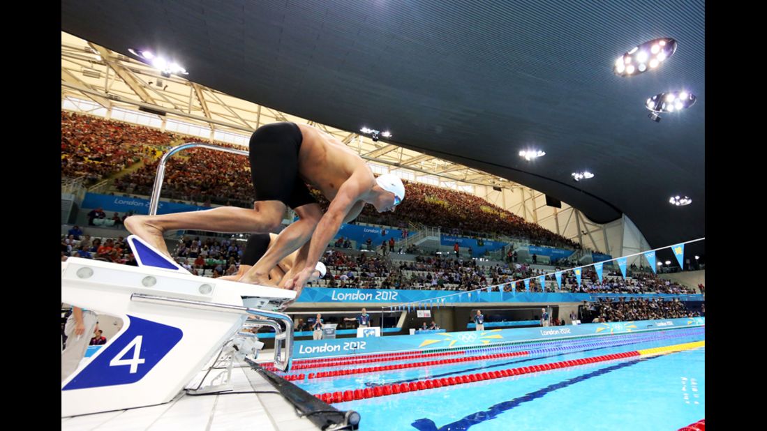 U.S. swimmer Ryan Lochte dives off of the starting block at the start of heat five of the men's 400-meter individual medley.