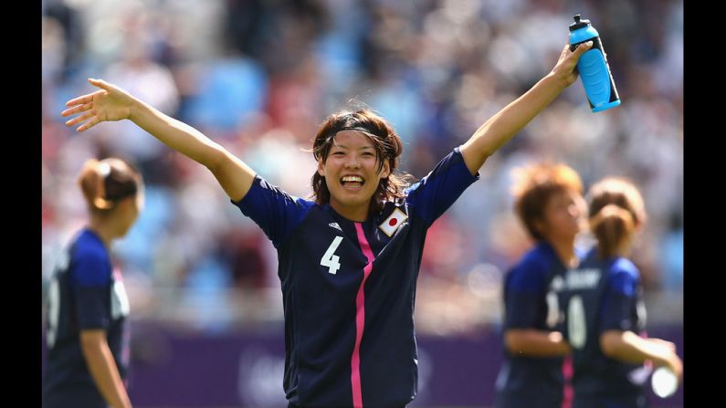 Saki Kumagai of Japan waves to the crowd after playing in a first-round women's soccer game between Japan and Sweden.
