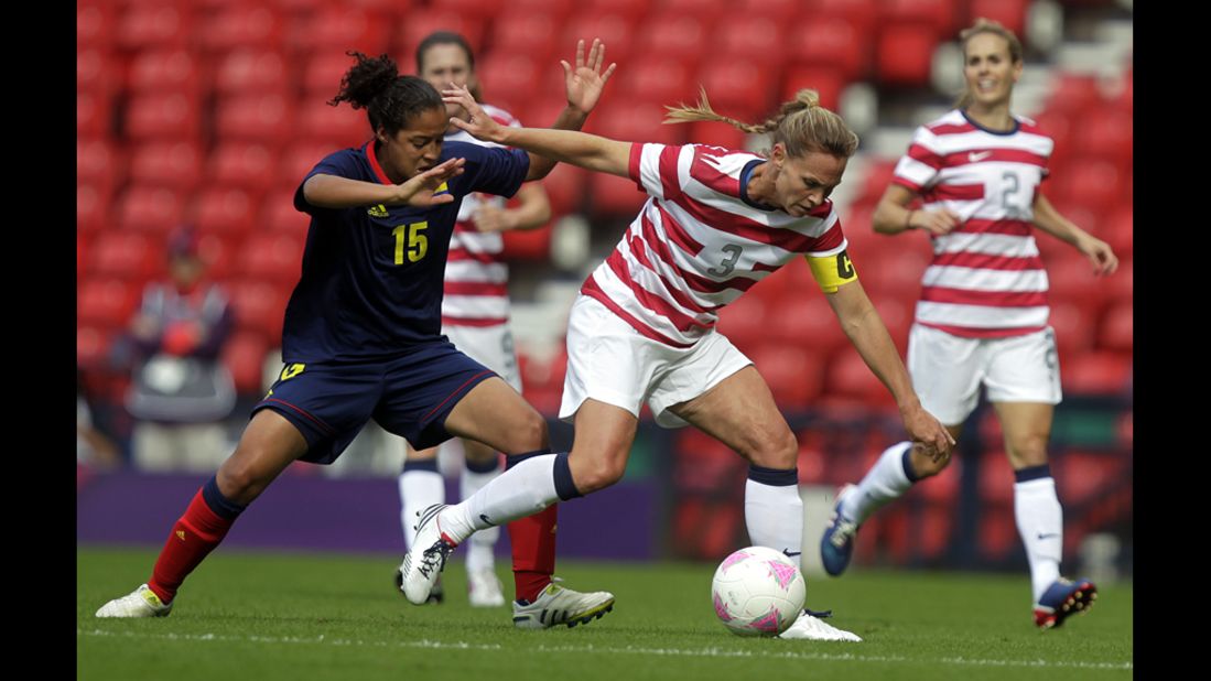 U.S. player Christie Rampone, right, vies with Colombia's Ingrid Vidal during the women's soccer competition. 