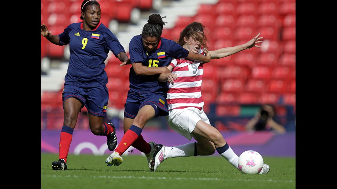 American Heather O'Reilly, right, vies with Colombia's Ingrid Vidal, second right, during a women's soccer game.