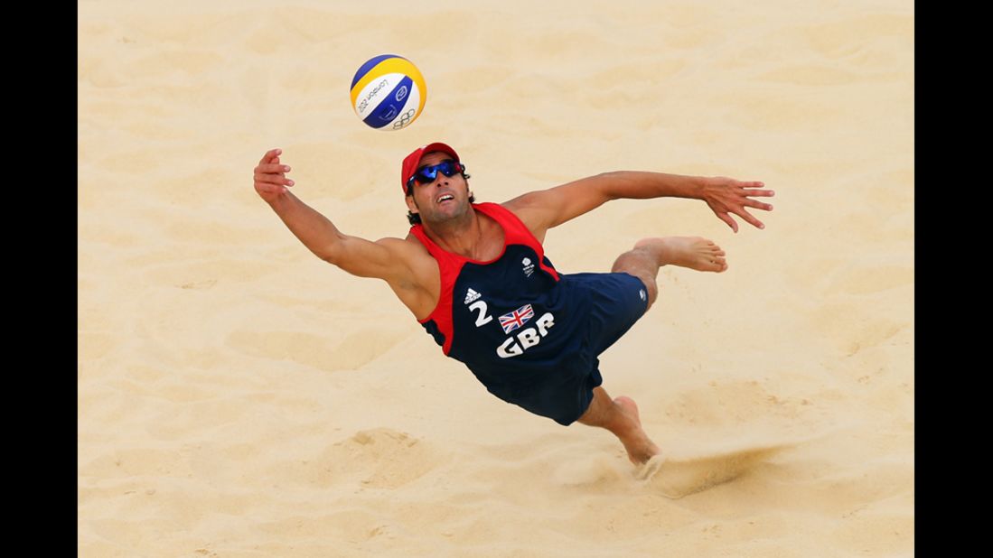 Steve Grotowski of Great Britain dives for the ball during the men's beach volleyball preliminary round.
