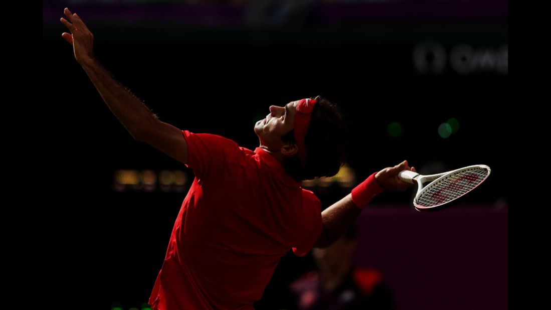 Roger Federer of Switzerland serves against Alejandro Falla of Colombia during their men's singles tennis match.