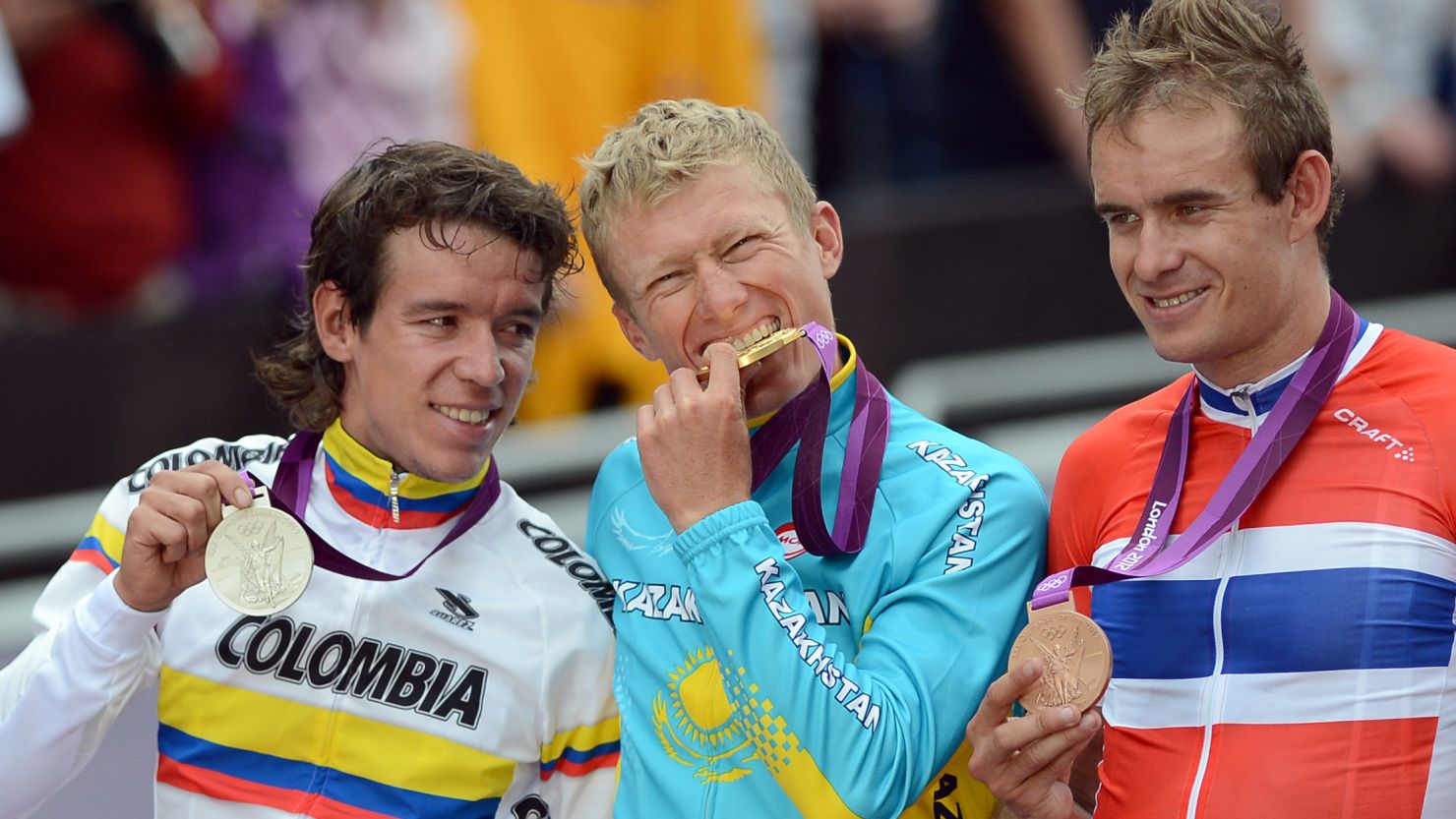  Vinokourov, centre, Uran, left, and Kristoff, right, on the podium after being presented with their medals