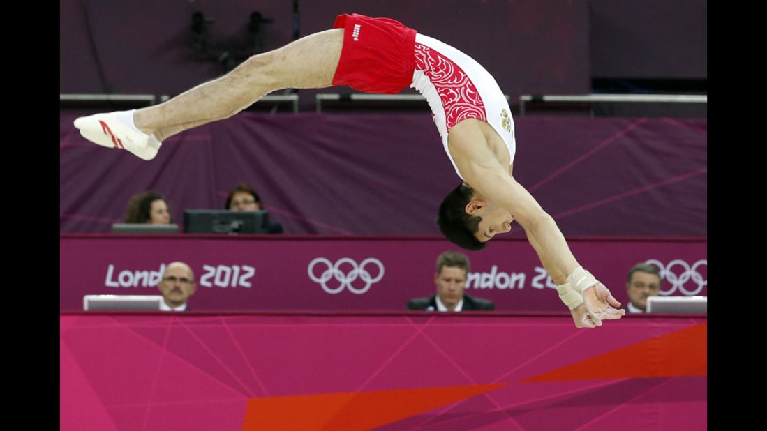 Russian gymnast Emin Garibov competes on the floor during the men's qualification of the artistic gymnastics event.