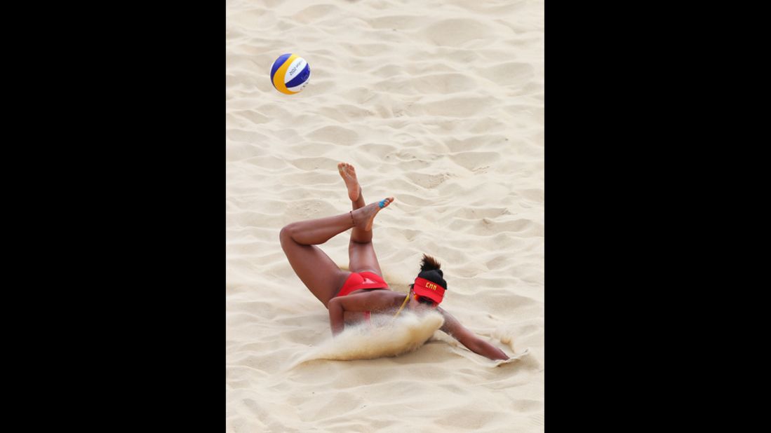 Chen Xue of China dips to return the ball during the women's beach volleyball match between China and Russia. See photos from <a href="http://www.cnn.com/2012/07/29/worldsport/gallery/olympics-day-two/index.html" target="_blank">day two of the games.</a>