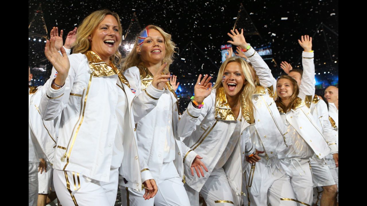 Members of the Britain's delegation parade wave.