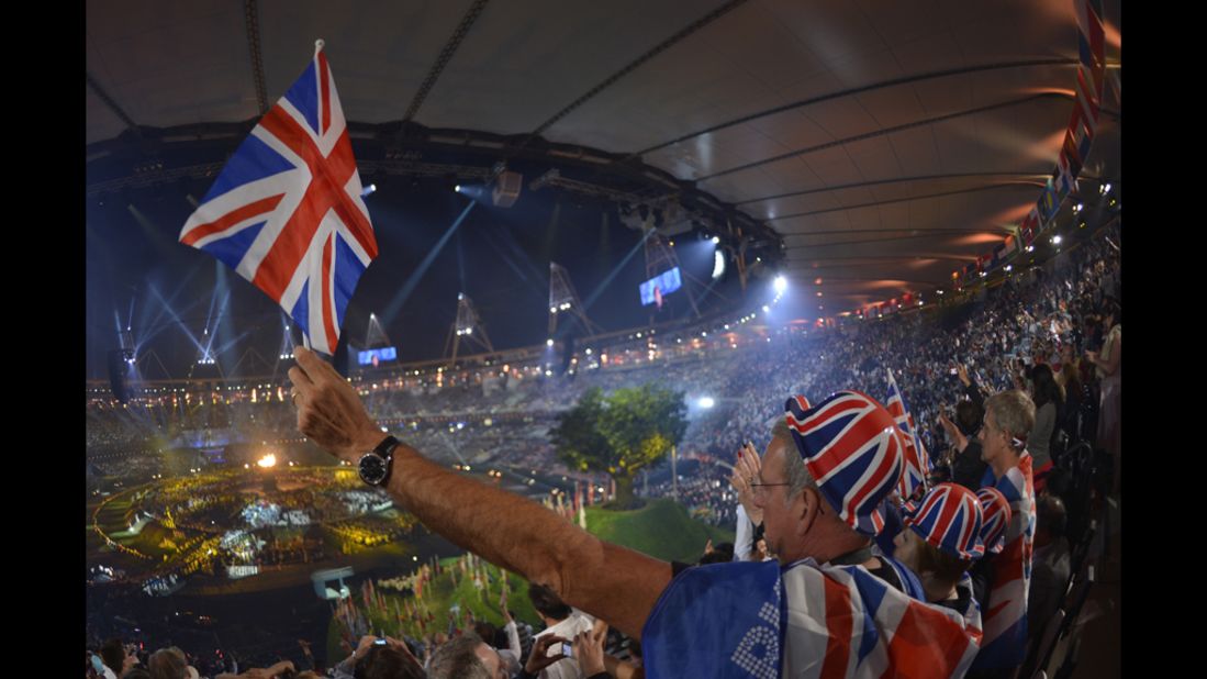 British spectators cheer as they attend the opening ceremony.