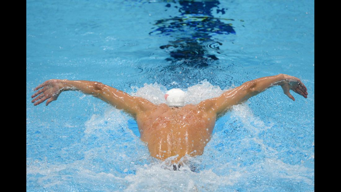 U.S. swimmer Michael Phelps competes in the men's 400 meter individual medley heats.