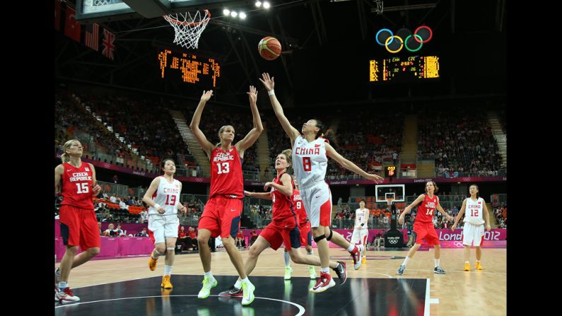 Lijie Miao of China, No. 8, battles for the basketball against Petra Kulichova, No. 13, of Czech Republic.