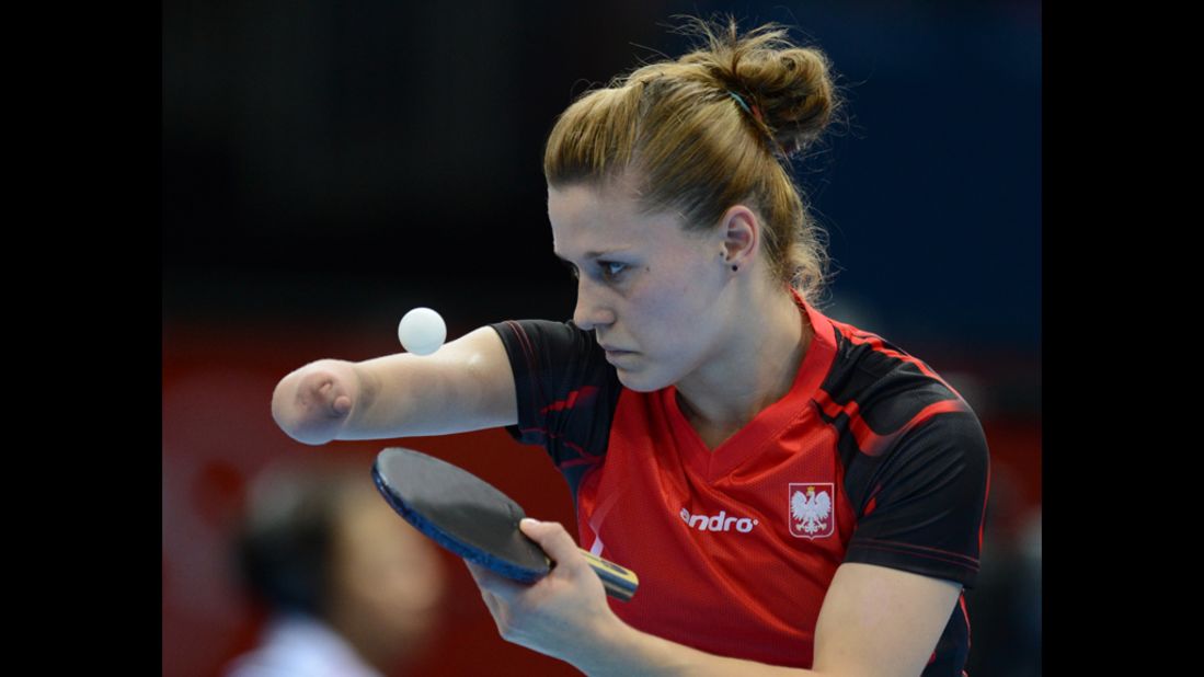 Poland's Natalia Partyka serves during a preliminary-round singles match against Denmark's Mie Skov in women's table tennis.