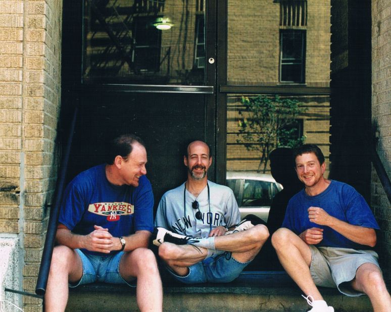 In 1991, none of the men had kids. But by 2001, between the three friends there were six kids. Only the three are featured here, but the reunion involves extended family and friends posing on the stoop.<br />