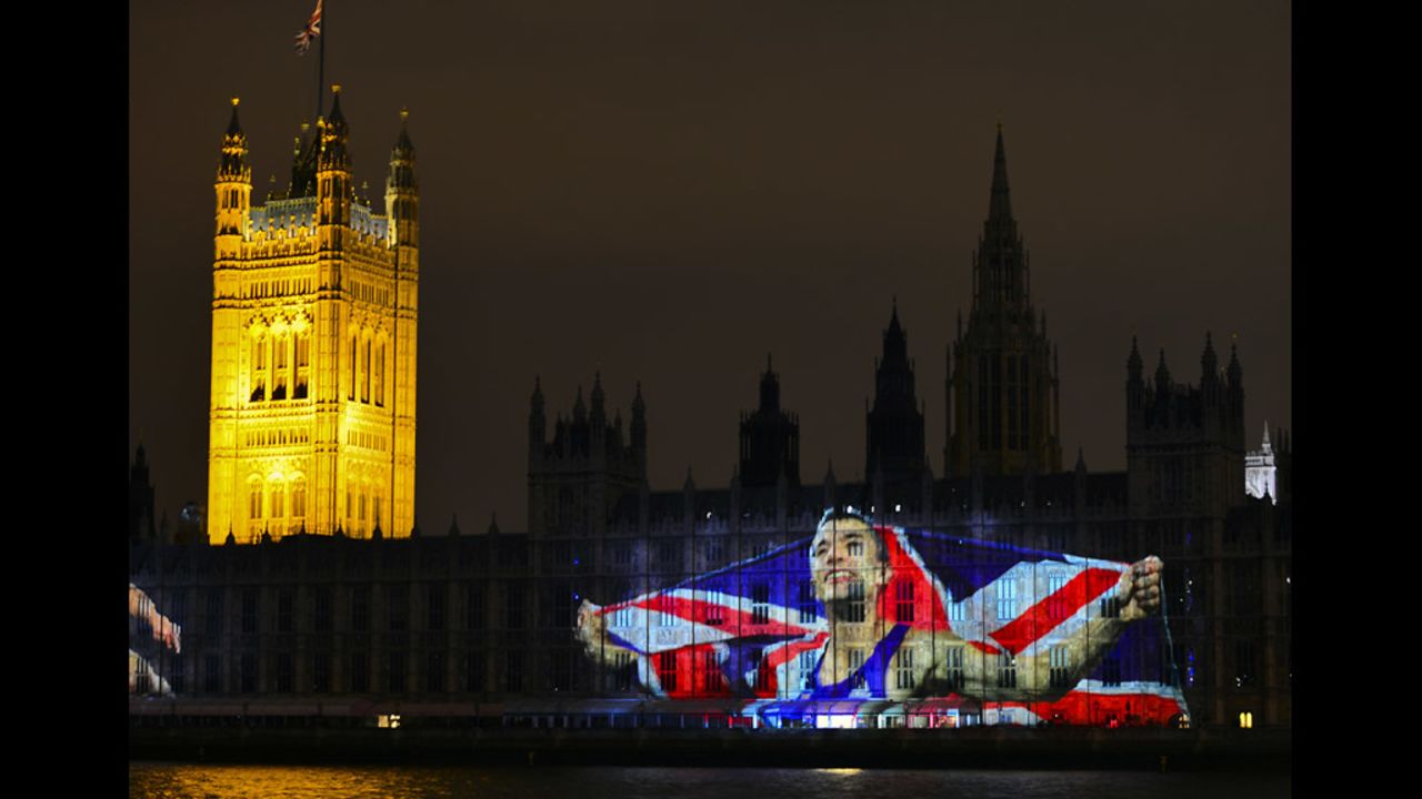An image of British Olympic champion Jonathan Edwards is projected on the Houses of Parliament .