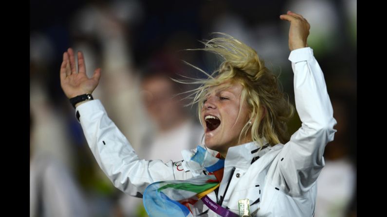 Philippine Van Aanholt, an independent Olympic athlete, parades during the opening ceremony