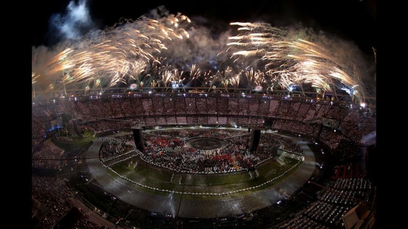 Fireworks explode from the stadium roof.