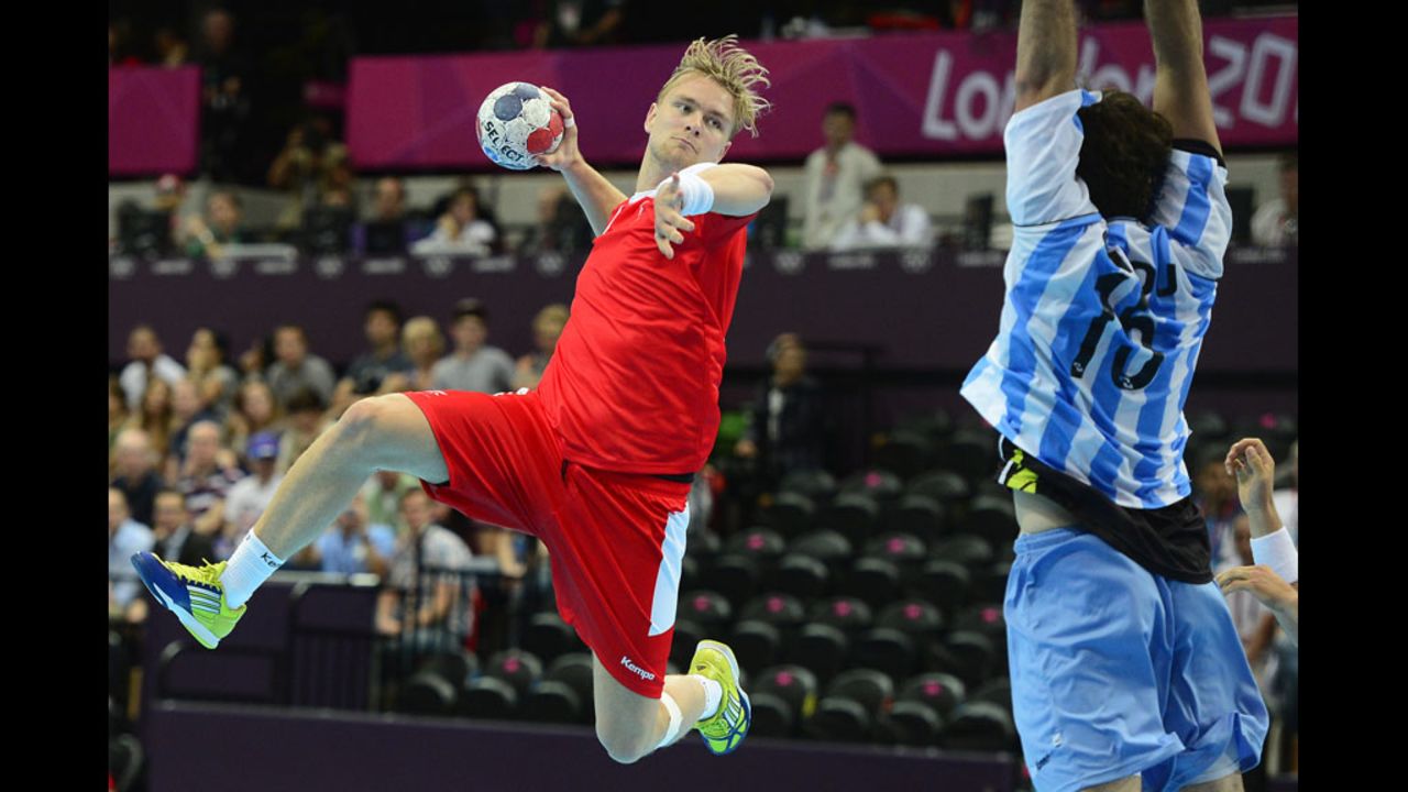 Aron Palmarsson of Iceland jumps to shoot during the men's preliminaries handball match against Argentina.