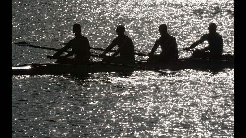 Finland's Lightweight Men's Four take a break from rowing during practice.