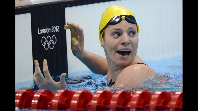 Australia's Emily Seebohm celebrates after breaking the Olympic record in the women's 100-meter backstroke heat.