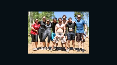 Alex Teves, center, at a Tough Mudder obstacle course designed by British Special Forces to test endurance and teamwork.