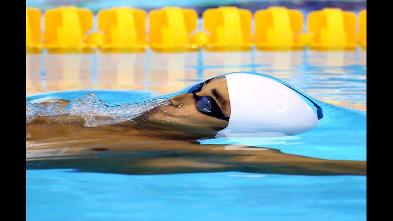 Sri Lanka's Heshan Unamboowe competes in the men's 100-meter backstroke heat.