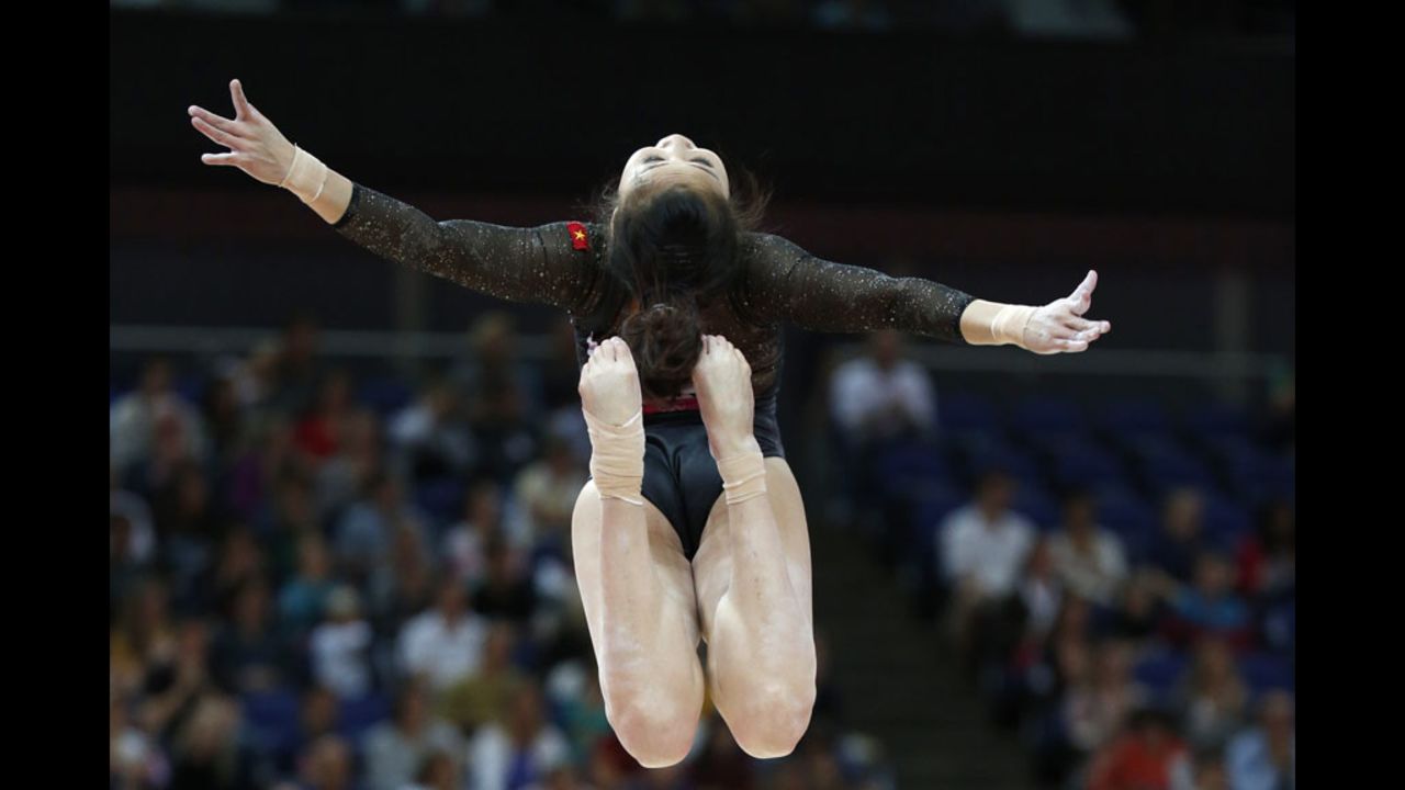 Vietnamese gymnast Thi Ngan Thuong Do performs on the beam during the women's qualification of the artistic gymnastics event.