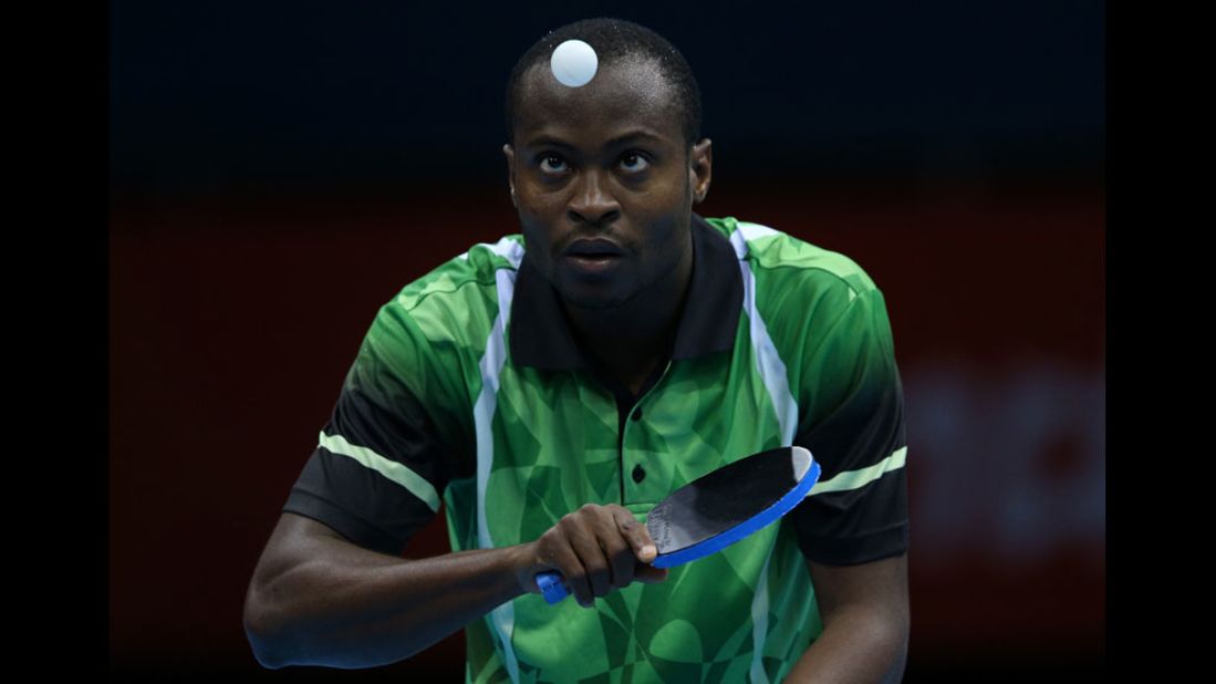 Nigeria's Quadri Aruna serves in his men's singles second-round table-tennis match against Turkey's Bora Vang.