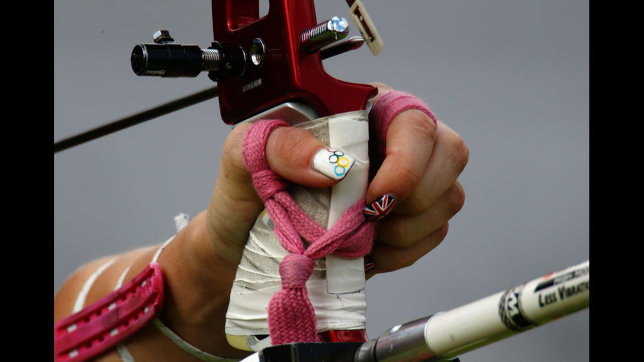 The festive nail polish of Great Britain's Amy Oliver stands out during the women's team archery elimination match between Britain and Russia.