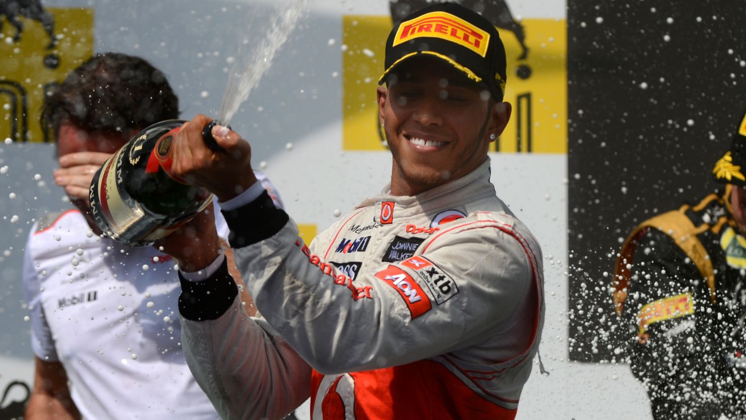 Lewis Hamilton celebrates his superb victory in the Hungary Grand Prix in traditional style. 