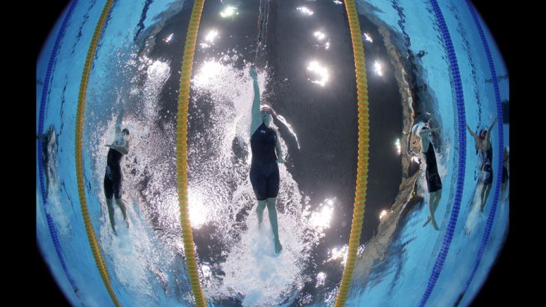 Great Britain's Rebecca Adlington, center, competes in the women's 400-meter freestyle heat at the Aquatics Centre. 