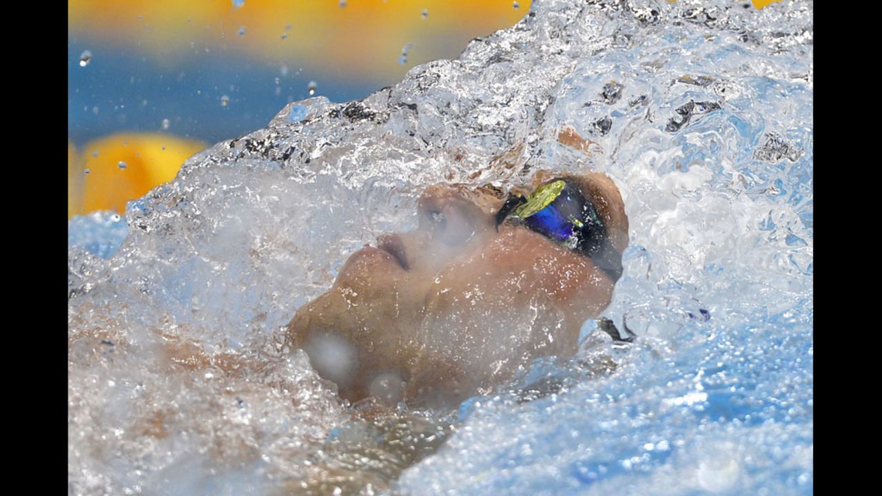 Nick Thoman of the United States competes in the men's 100-meter backstroke heat.