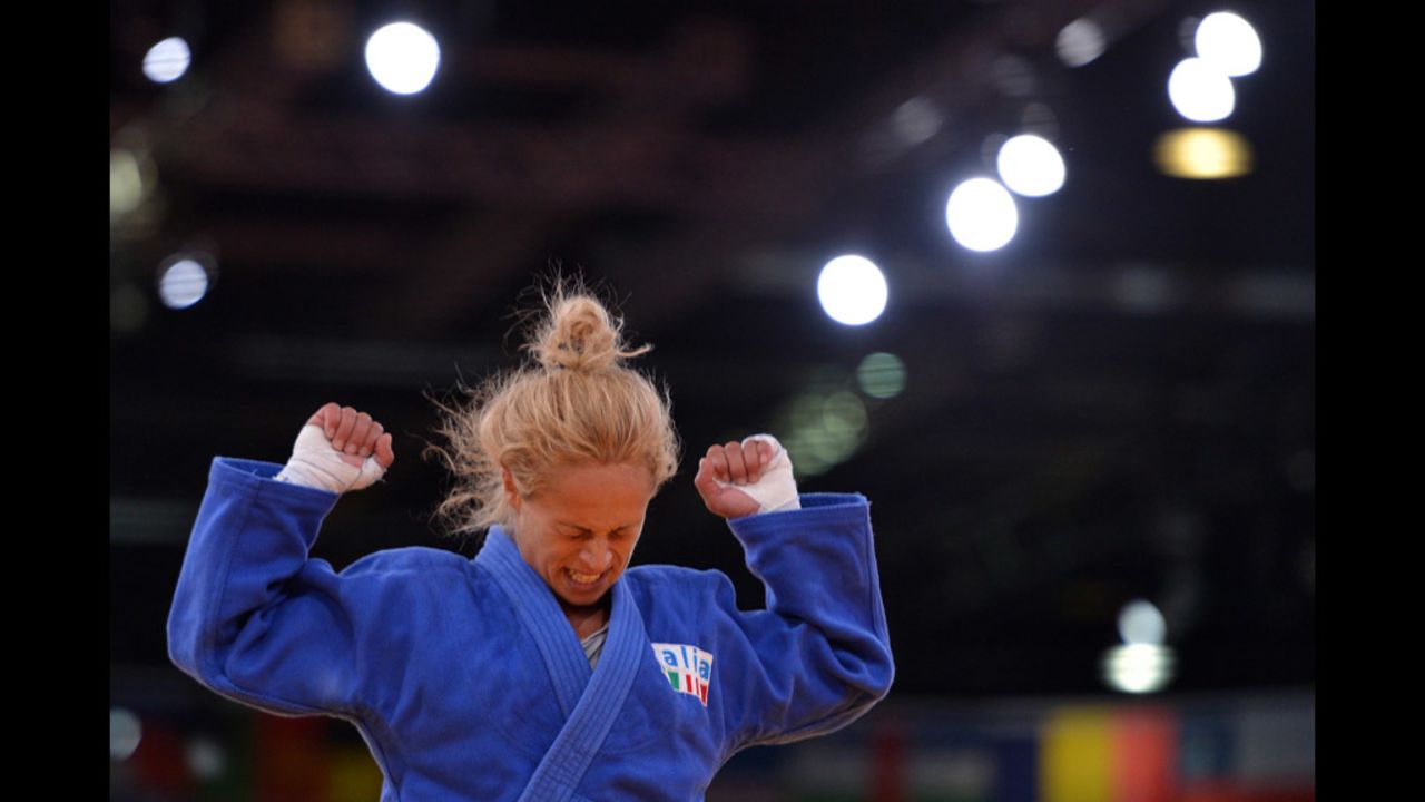 Italy's Rosalba Forciniti celebrates after winning against South Korea's Kyung-Ok Kim during the women's under 52-kilogram judo match. 