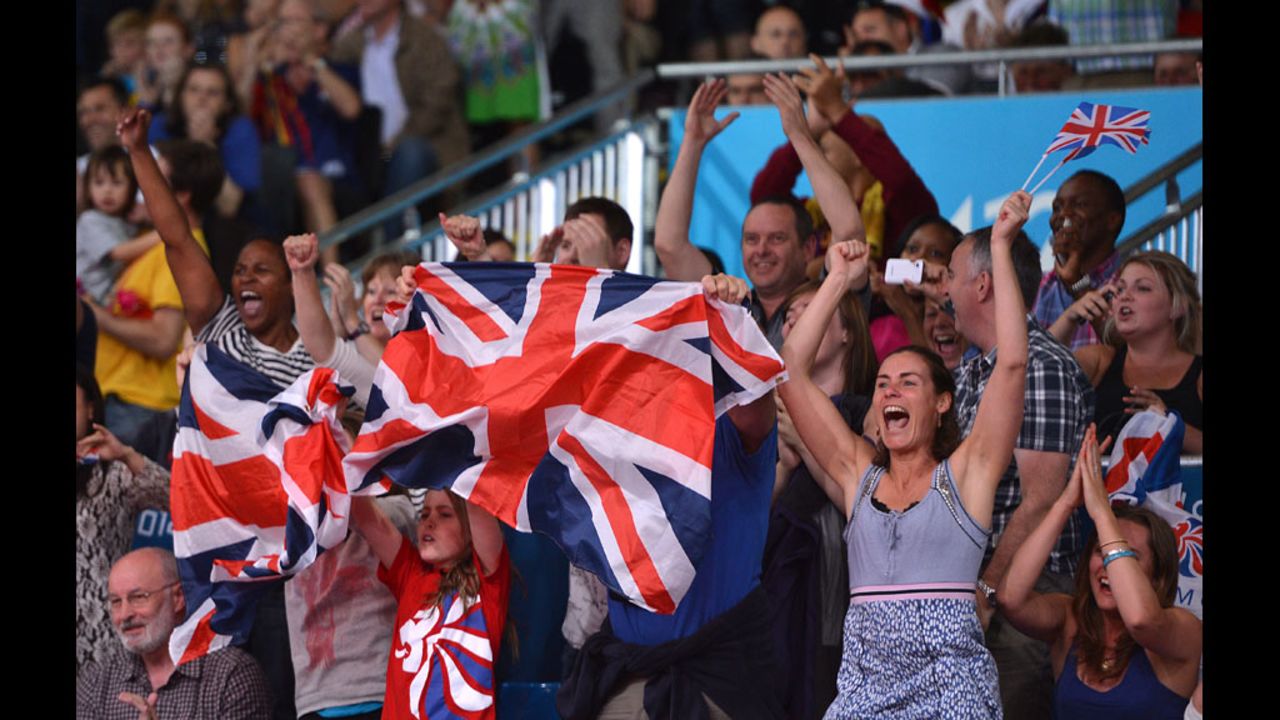 British fans cheer as Colin Oates of Great Britain defeats Tsagaanbaatar Khashbaatar of Mongolia in the men's under 66-kilogram judo match.