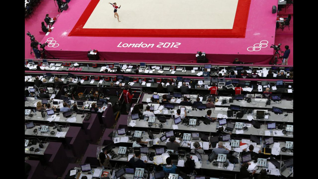A gymnast performs on the floor during the women's qualification of the artistic gymnastics event.
