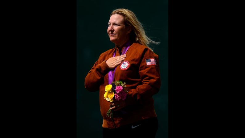 Kim Rhode listens to the U.S. national anthem after winning the gold medal in women's skeet shooting Sunday.