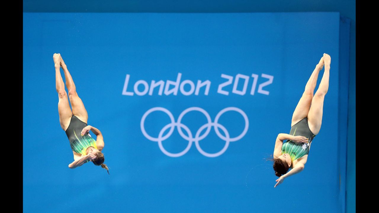 Sharleen Stratton and Anabelle Smith of Australia compete in the women's synchronized 3-meter springboard final at the Aquatics Centre.