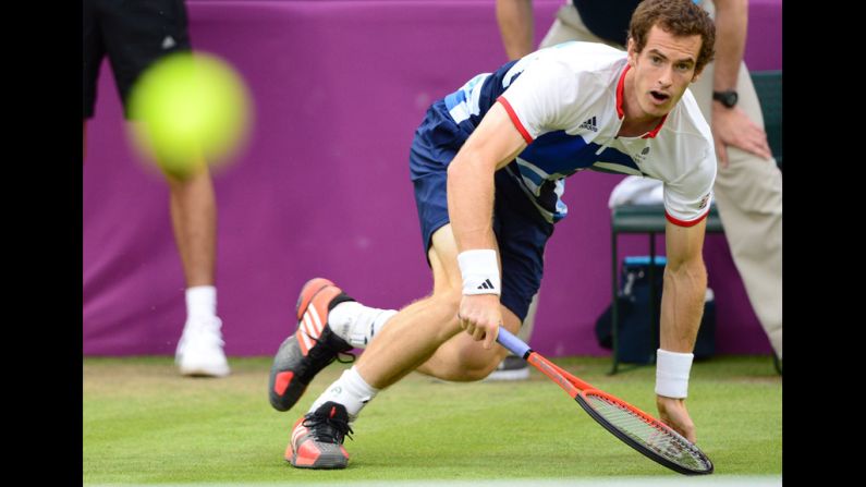 Andy Murray of Britain returns the ball against Stanislas Wawrinka of Switzerland during their men's singles tennis match.