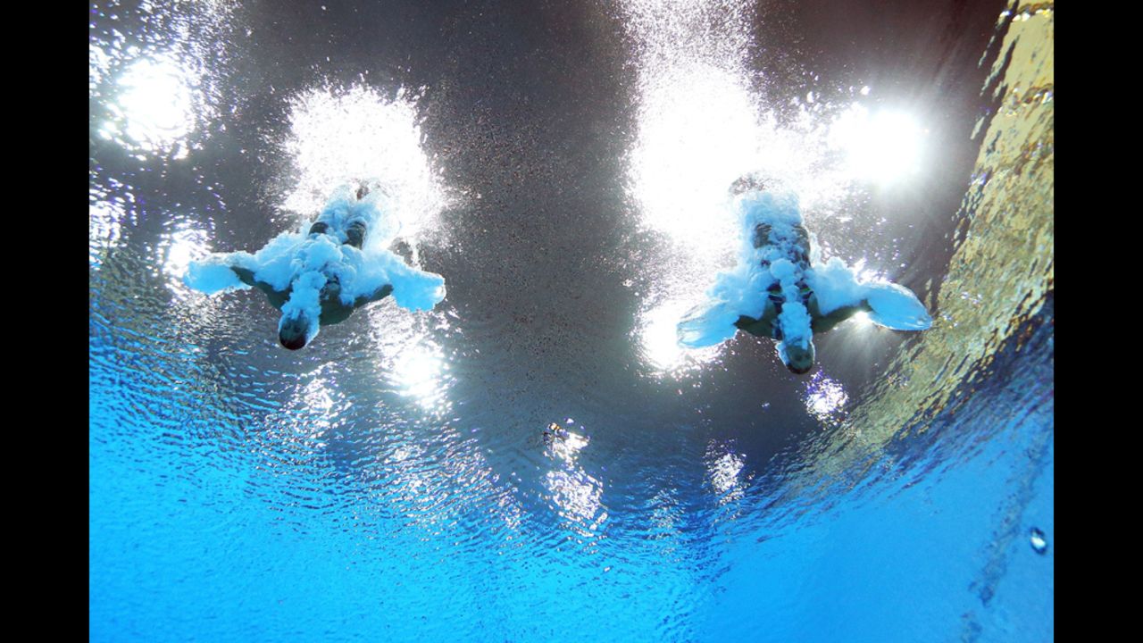 Francesca Dallape and Tania Cagnotto of Italy compete in the women's synchronized 3-meter springboard final at the Aquatics Centre.