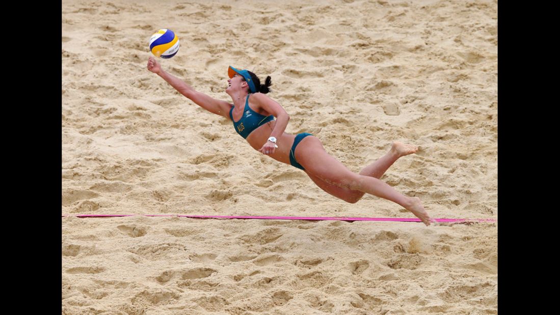 Becchara Palmer of Australia dives for the ball during a women's beach volleyball preliminary match against Germany.